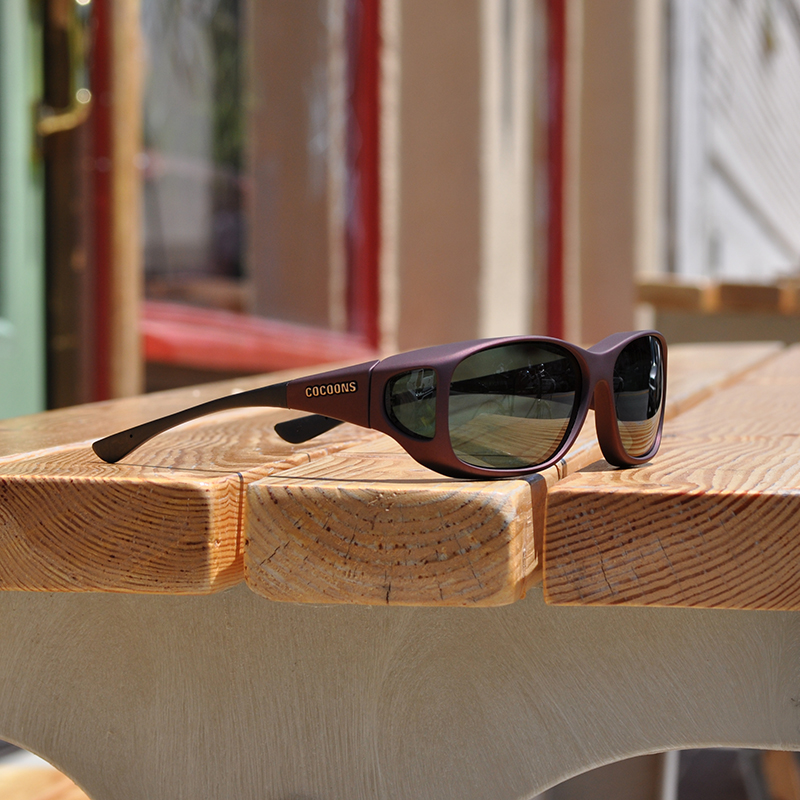 Cocoons Style Line MX resting on outdoor wooden table